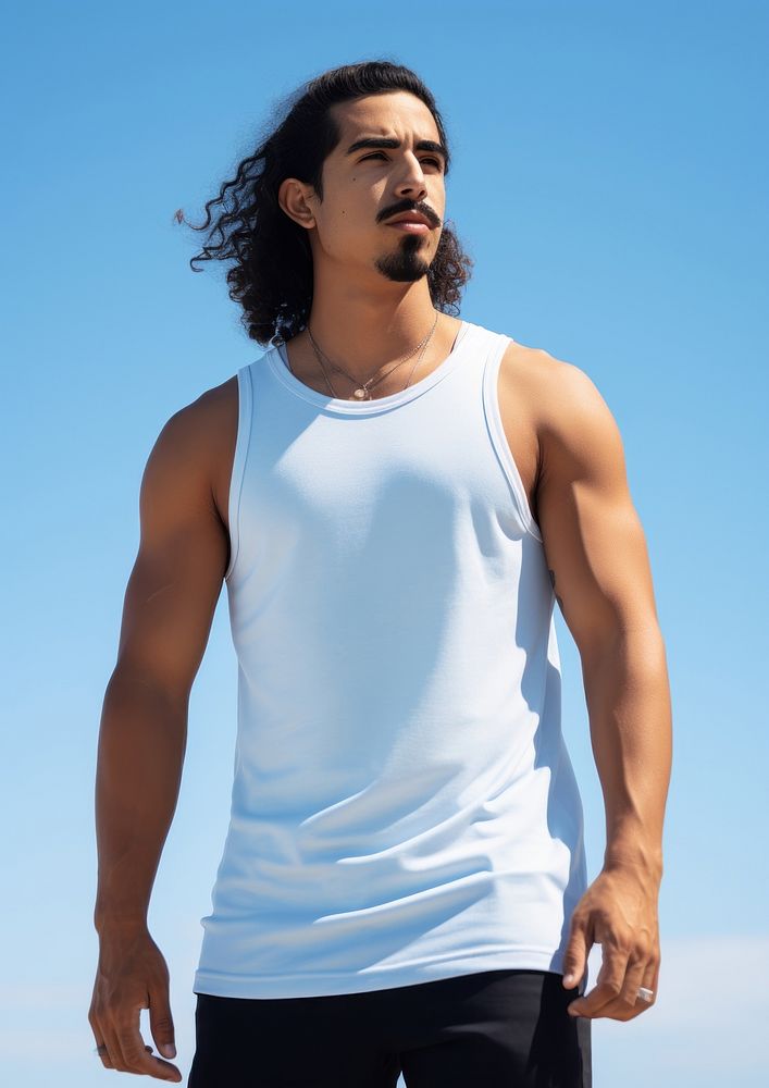 Hispanic young man standing white blue.