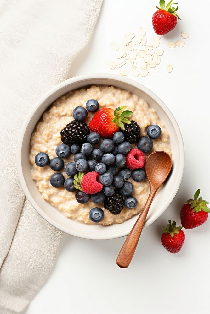 Oatmeal spoon bowl blueberry. AI generated Image by rawpixel.