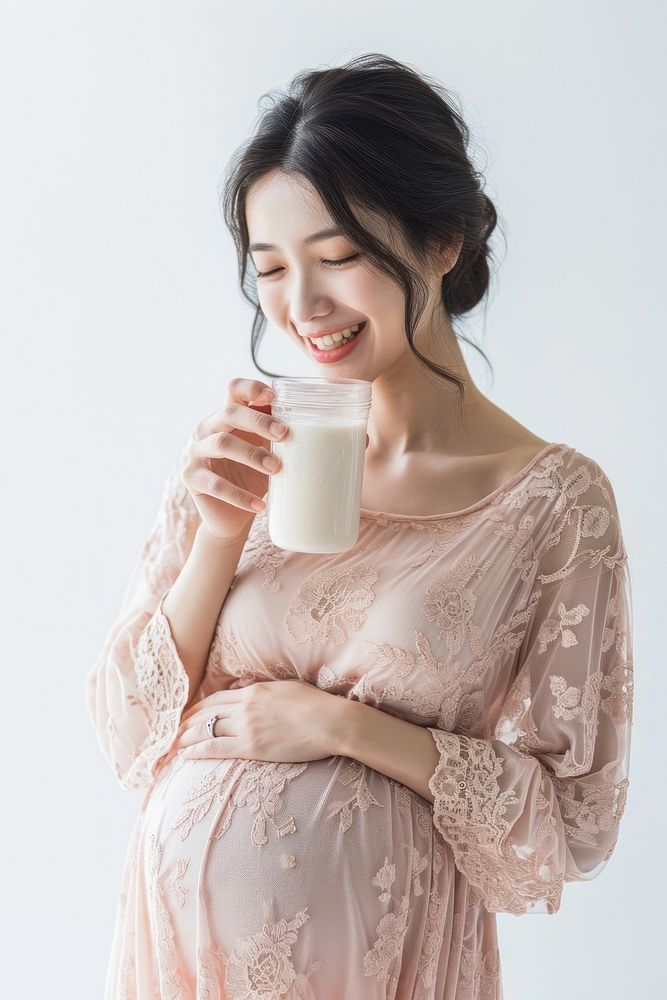 Pregnant asian woman drink milk drinking.