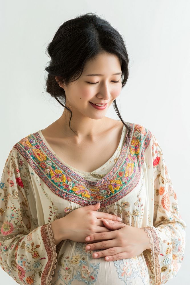 Pregnant asian woman portrait smiling blouse.