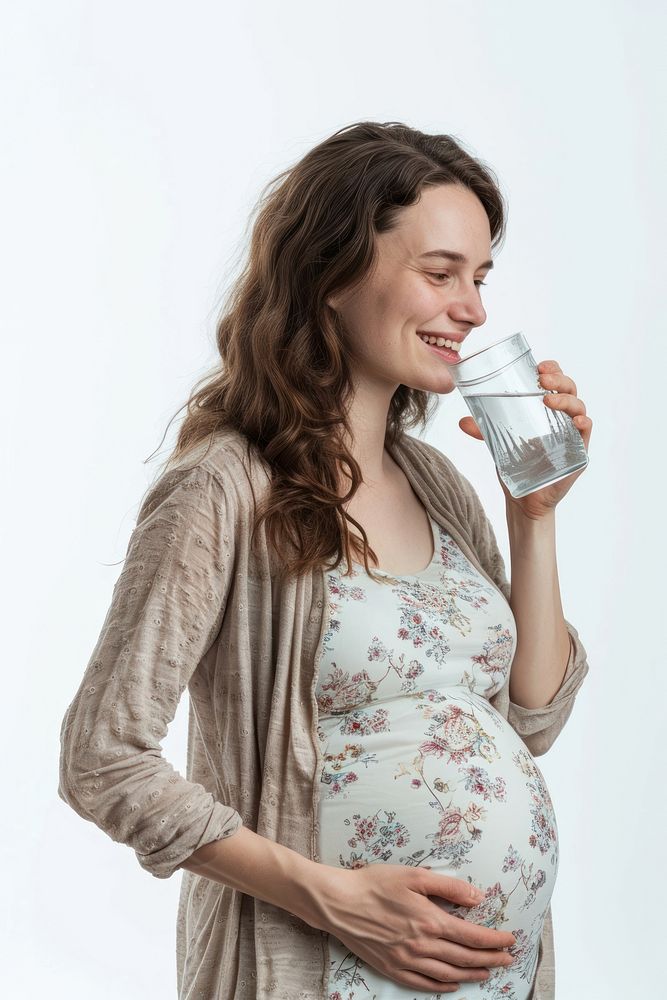 Pregnant british woman drinking portrait smiling.