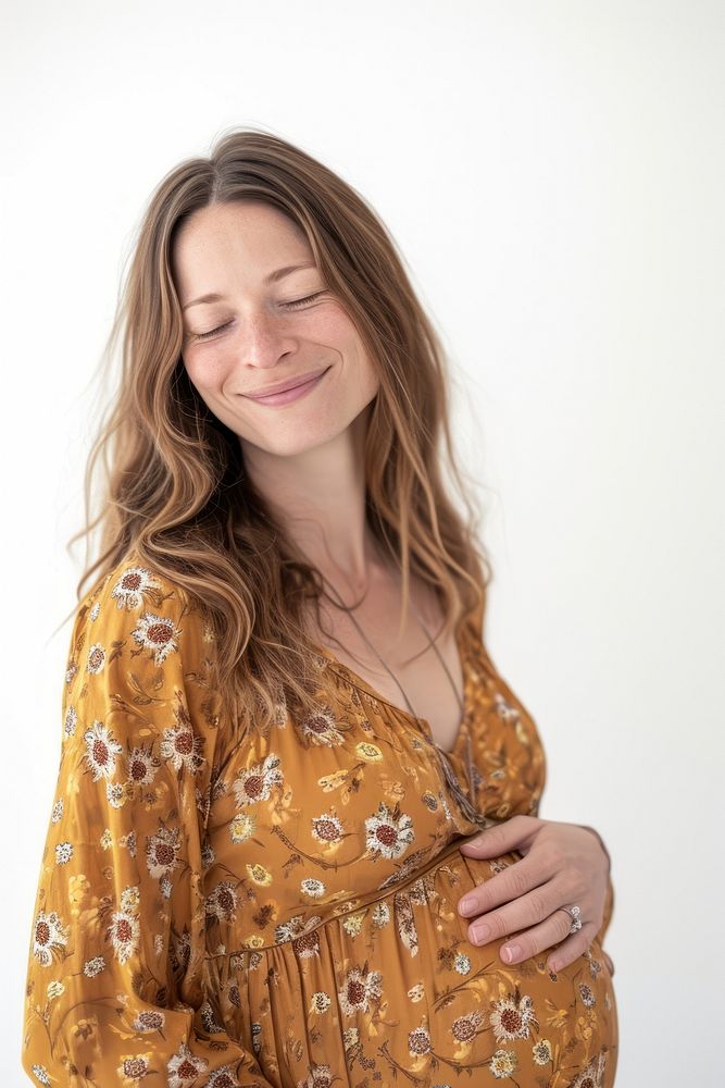 Pregnant british woman portrait smiling blouse.