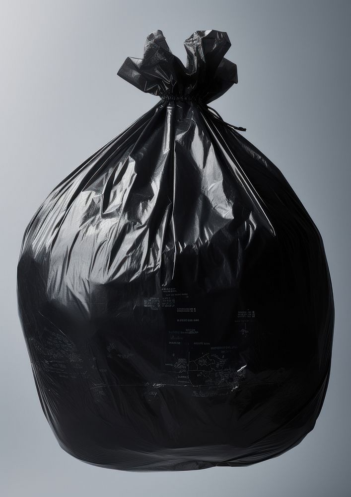 A black plastic bag covered the globe monochrome ammunition recycling.