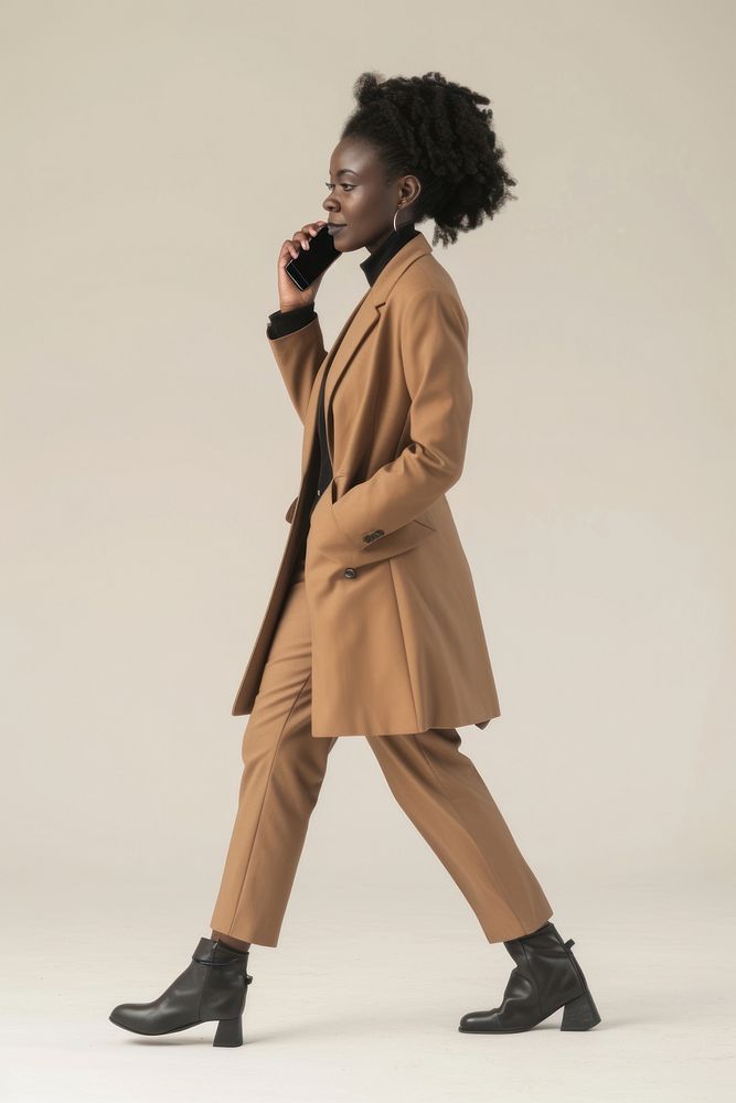 African-american adult woman overcoat footwear shoe.