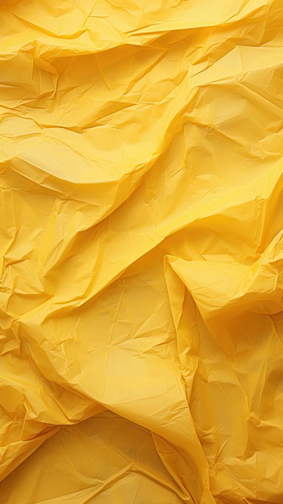 Old yellow crumpled paper backgrounds textured wrinkled.