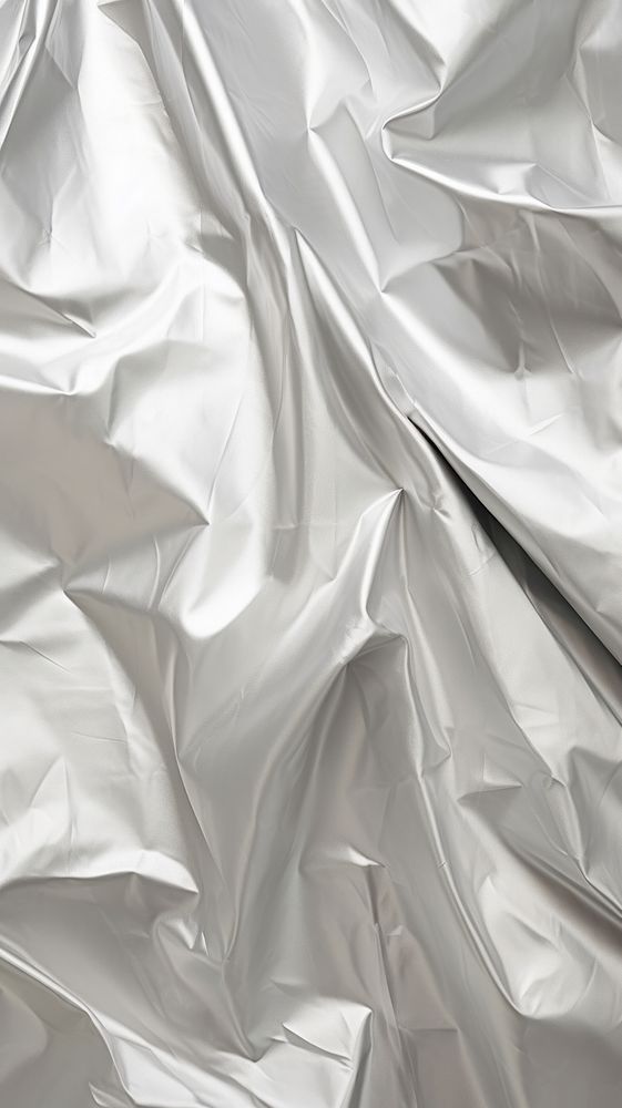 Old silver crumpled paper backgrounds aluminium wrinkled.
