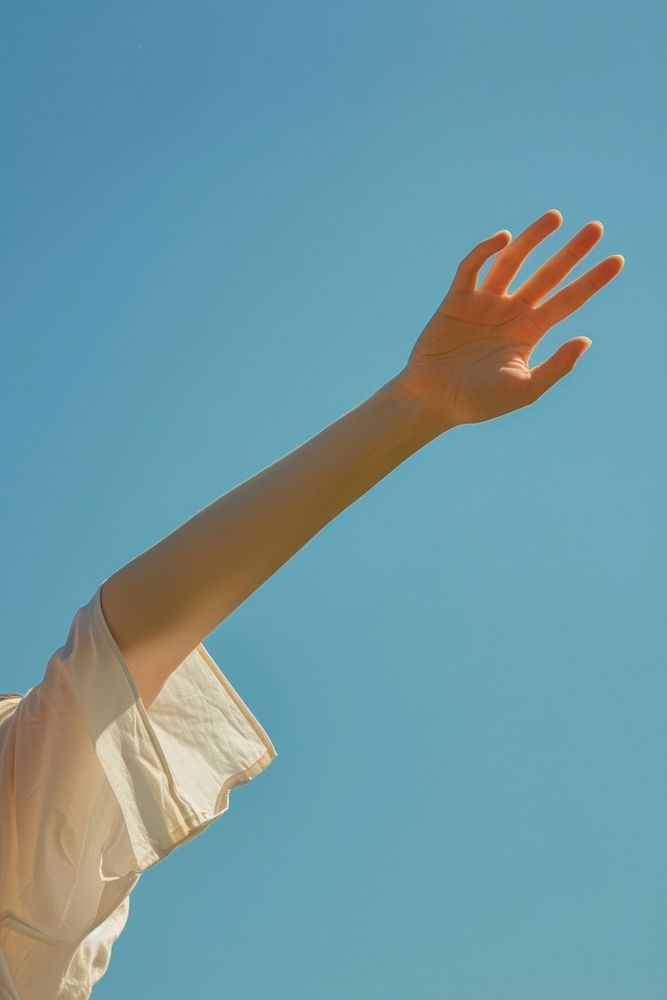 Woman arms waving blue sky gesturing.