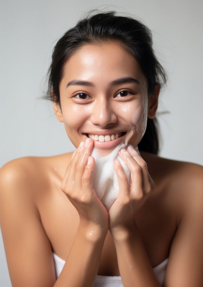 Woman cleaning her face smile portrait adult.