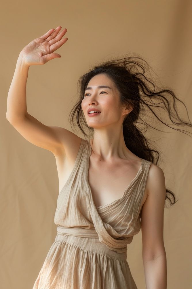 Asian woman arms waving adult hairstyle happiness.