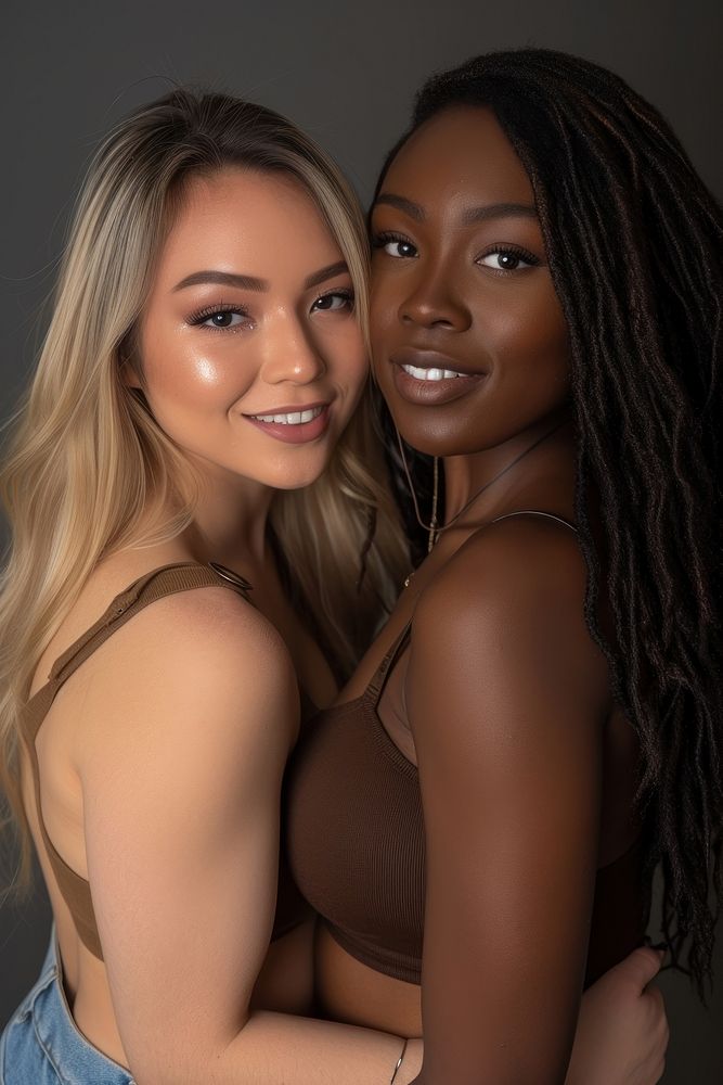 2 women body types with different ethnicities portrait adult smile.