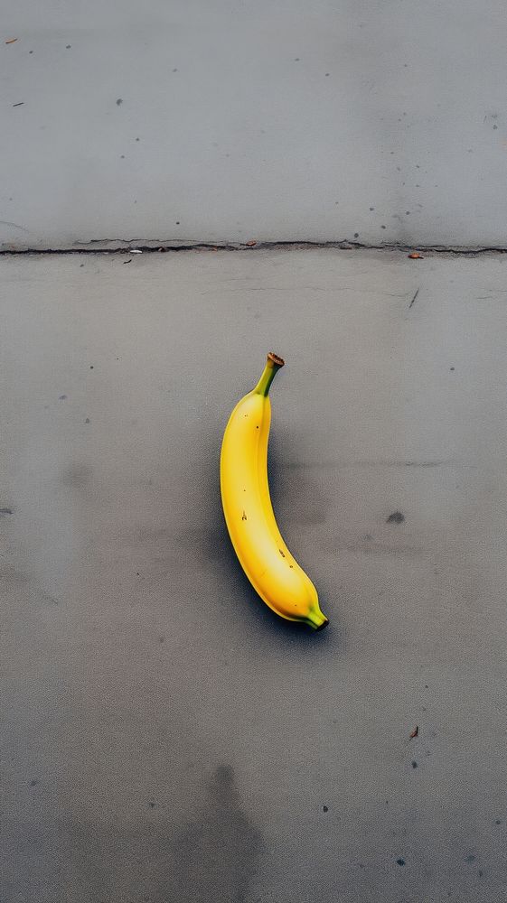  A big banana has fall to in street among the city fruit plant food. AI generated Image by rawpixel.