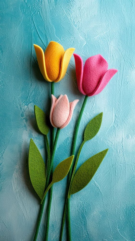Wallpaper of felt tulip art textile flower.