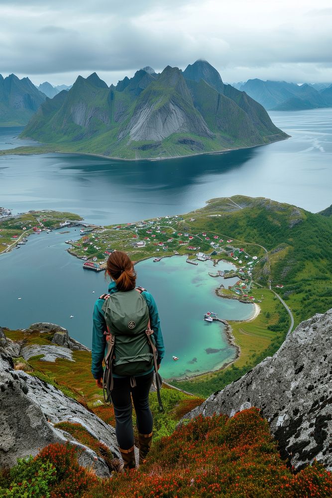 Woman hiking at Lofoten Norway adventure outdoors backpack.