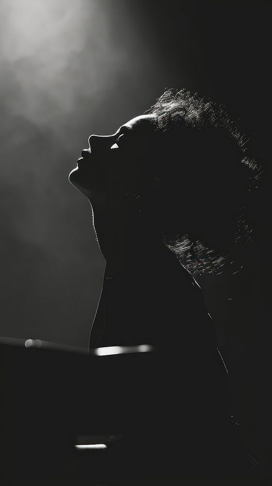 Photography of jazz singer backlighting photography silhouette.