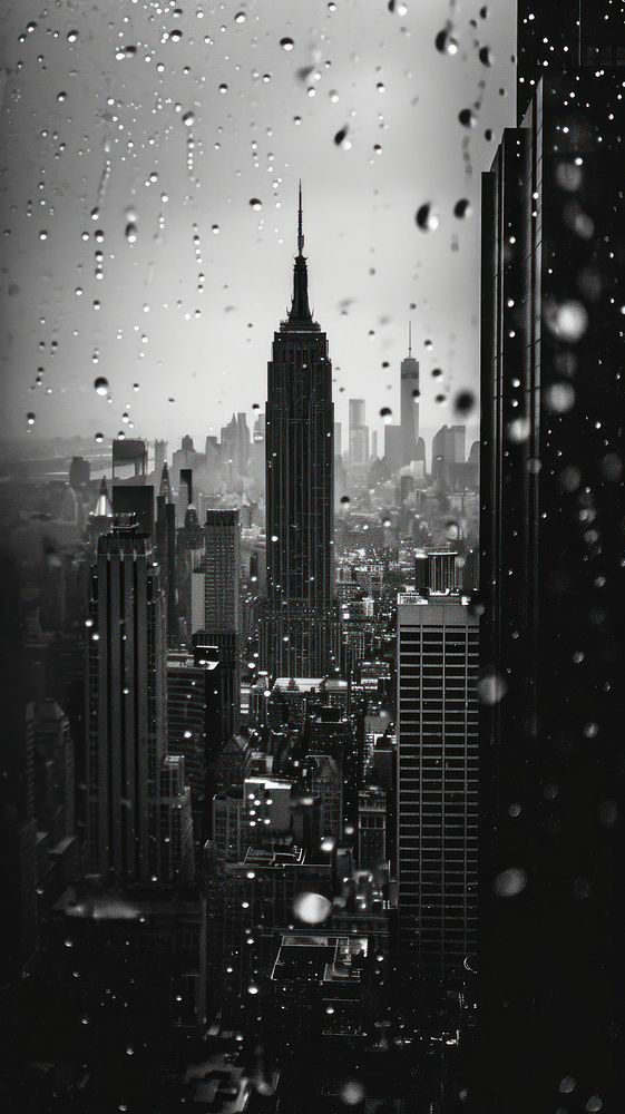 Photography of raining empire state building architecture motion tower.