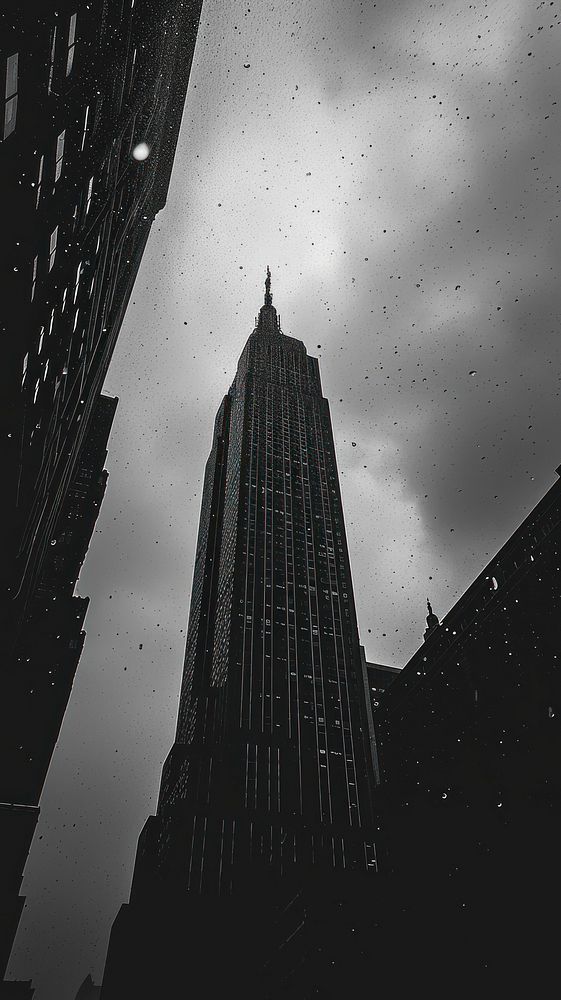 Photography of raining empire state building architecture landmark tower.