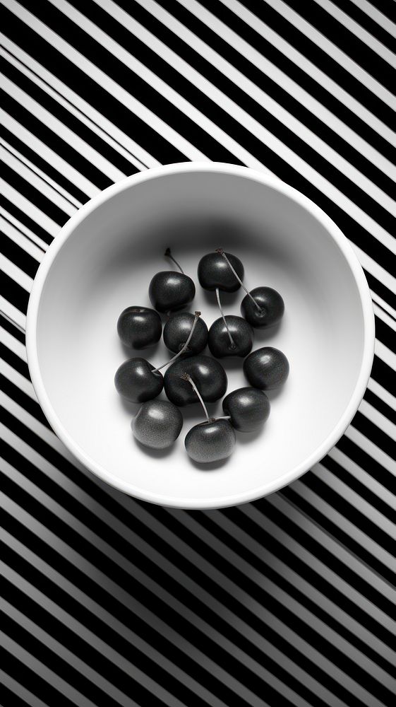 Photography of cherries monochrome plate black.