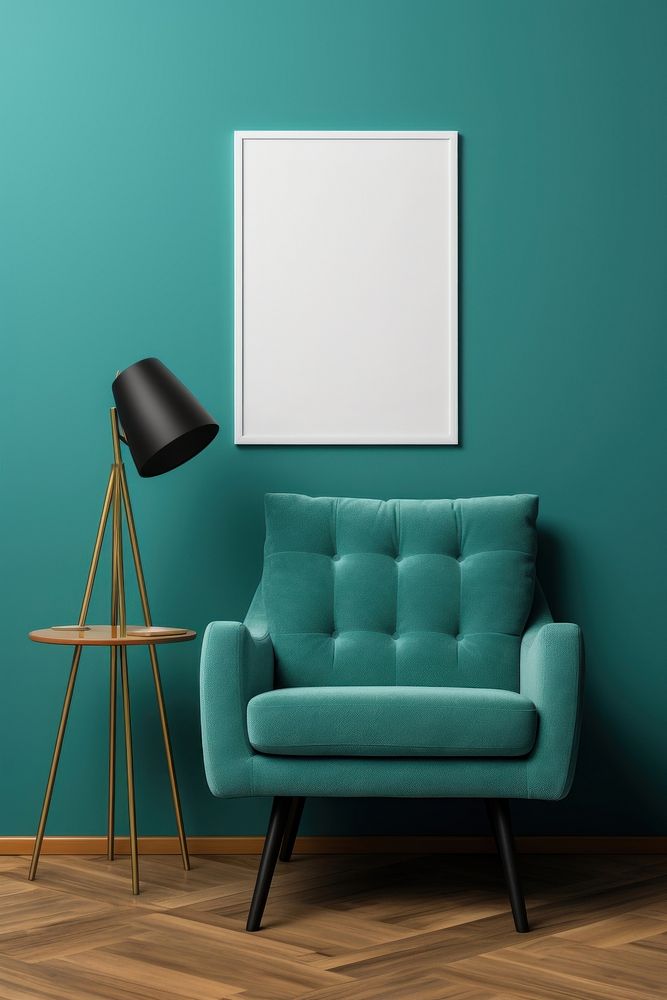White poster  laying on the deep turquoise color armchair furniture lamp architecture.