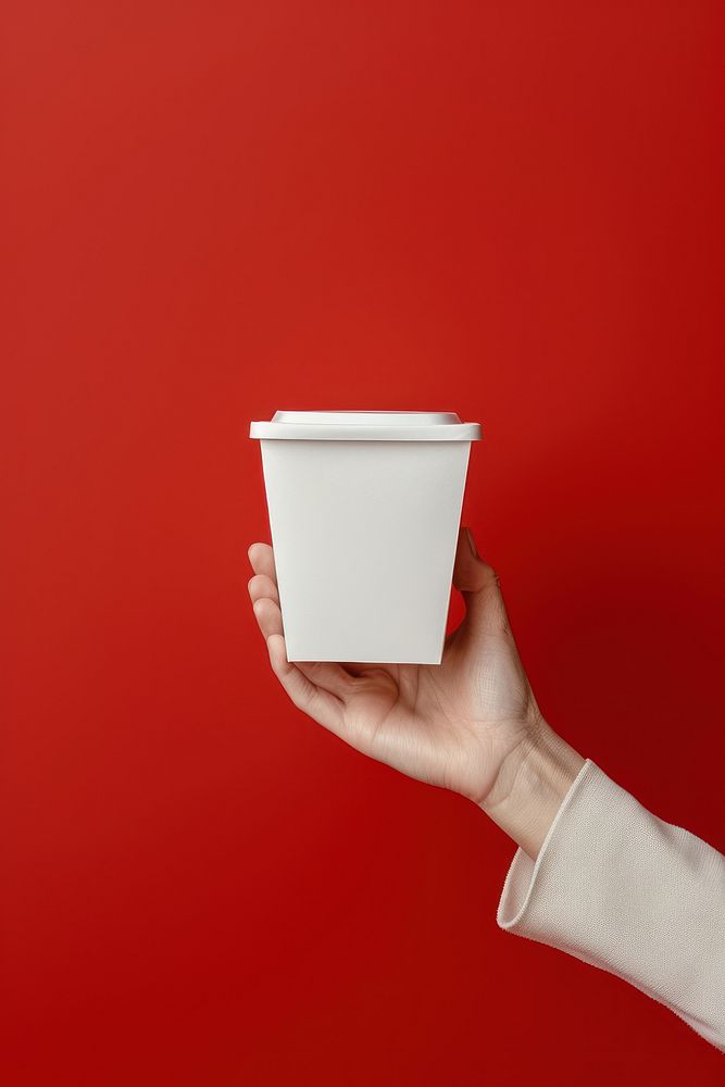 Noodle box  holding hand cup.