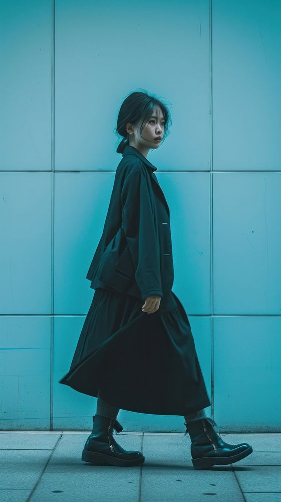 Asian woman person walking overcoat footwear adult.