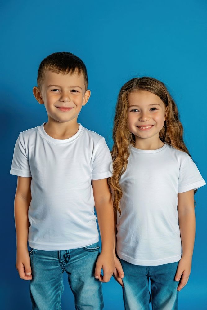 Boy and girl wearing white t-shirts portrait standing toddler.