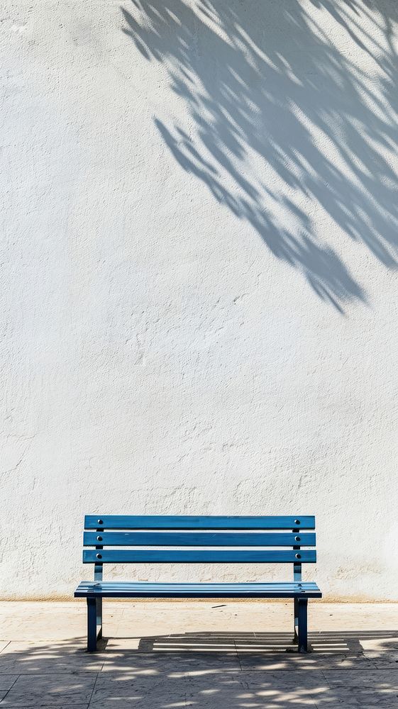 A blue bench furniture shadow wall.