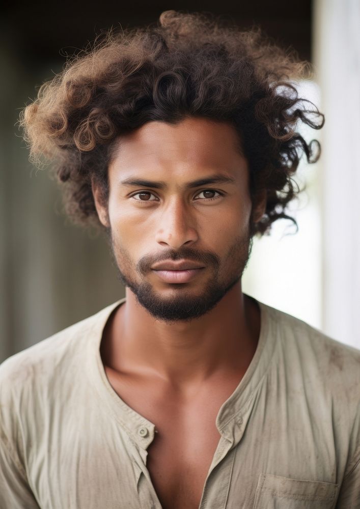 A Micronesian male with original hair style portrait adult photo.