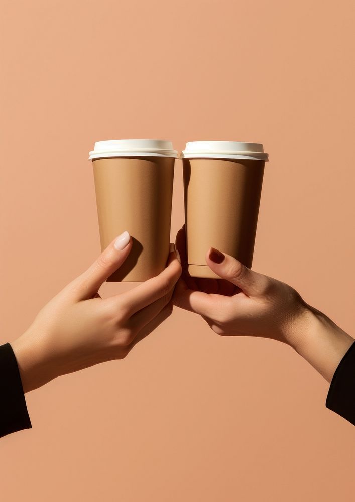 Take away cup holder with 2 coffee cup hand holding finger.
