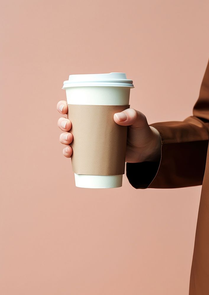Hand holding bag of paper coffee cups drink mug refreshment.