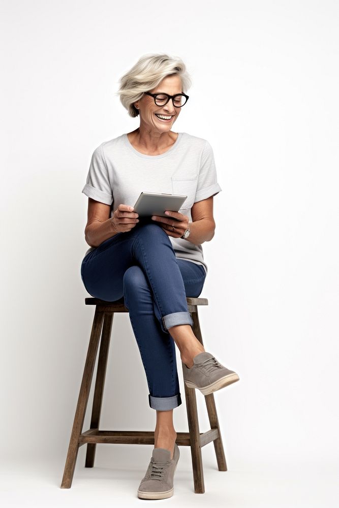 Senior short hair woman wear glasses furniture portrait sitting. AI generated Image by rawpixel.