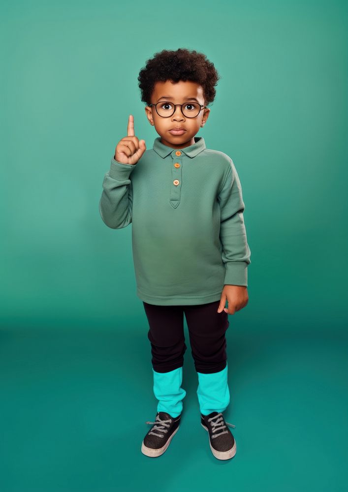 Kid pointing finger at mouth portrait footwear child. AI generated Image by rawpixel.