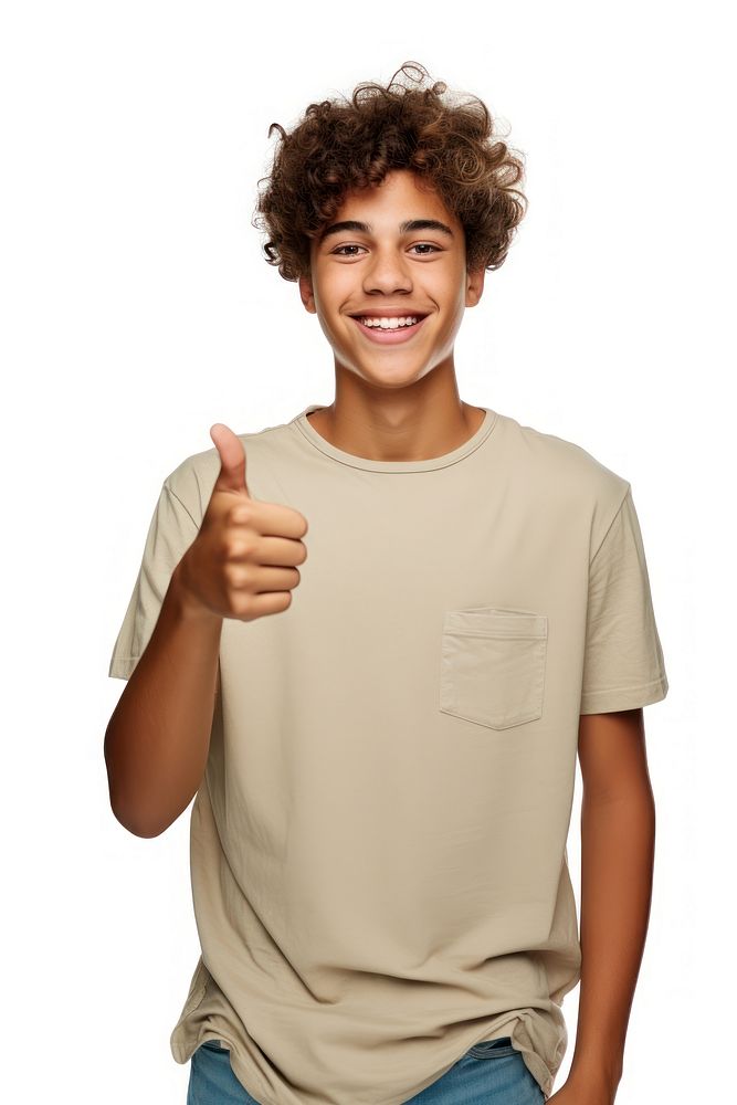 A teenage boy in casual attire standing and pointing his thumb finger to the side to presenting a product smile t-shirt…