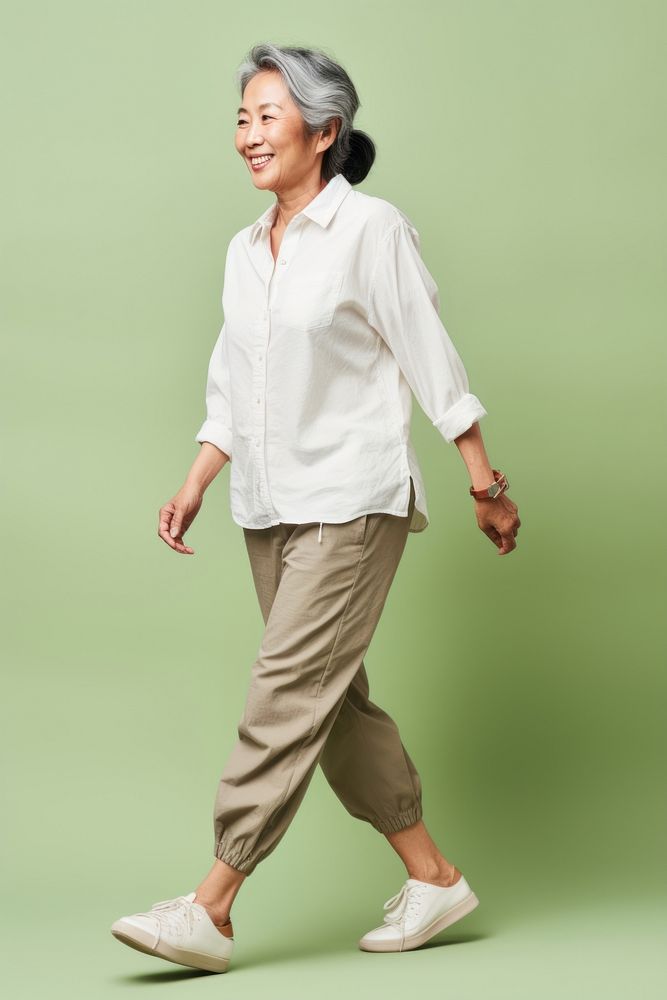 A Asian senior woman walking person adult.