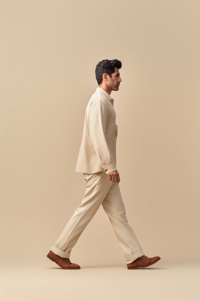 A west asian man walking standing person.