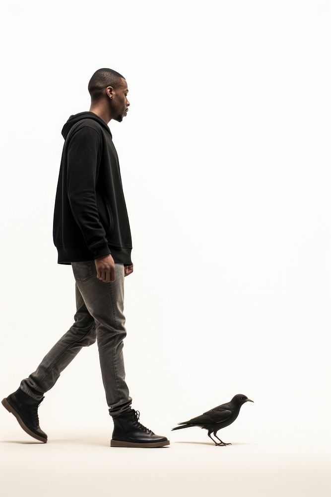 Black man walking with bird footwear standing animal.