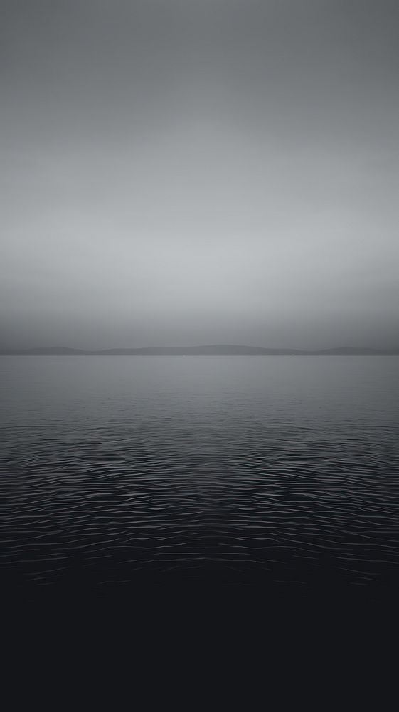 A body of water surface backgrounds outdoors horizon.
