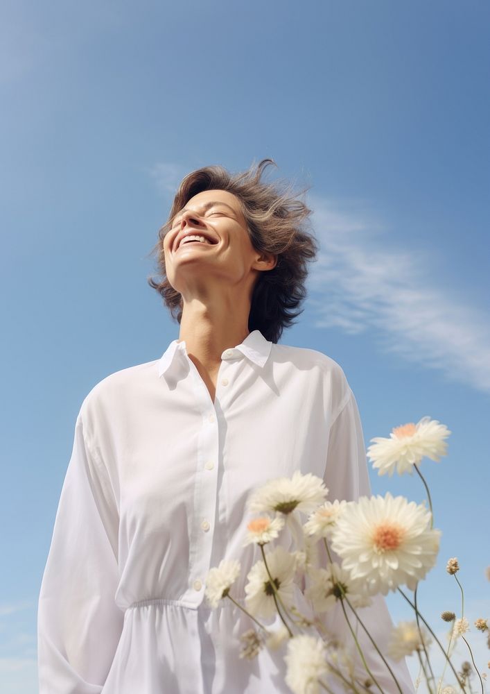 Happy Mature woman wearing white outfit flower adult sky.