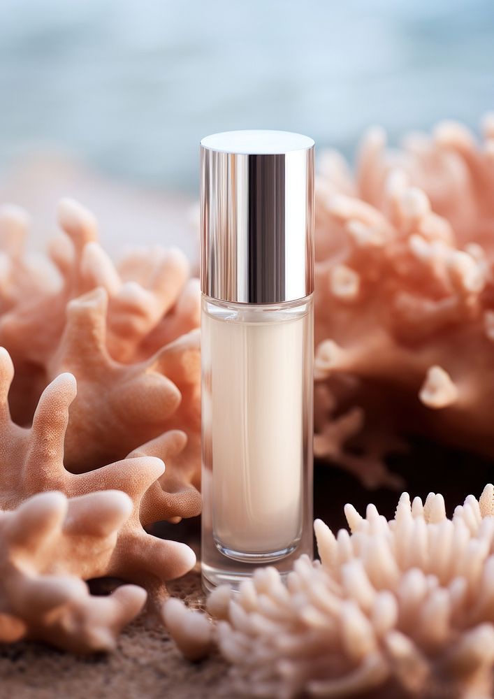 A Moisturizing serum floating on top of a drift coral cosmetics underwater container. AI generated Image by rawpixel.