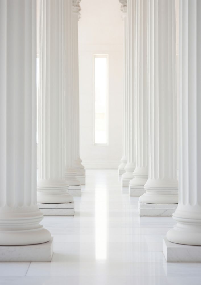  A row of white columns sitting on top of a marble floor architecture building corridor. 