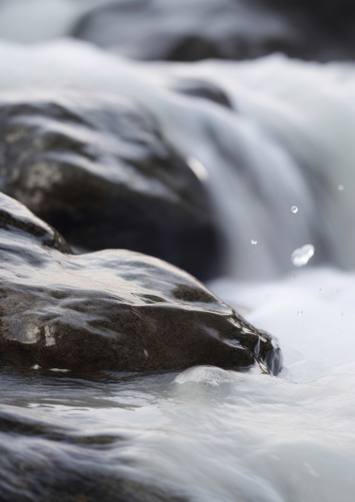  A stream of water with rocks waterfall outdoors nature. 