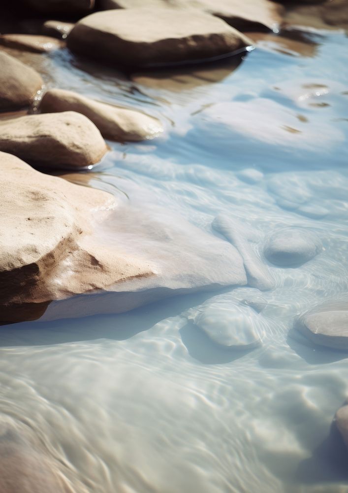  A stream of water with rocks backgrounds outdoors nature. AI generated Image by rawpixel.