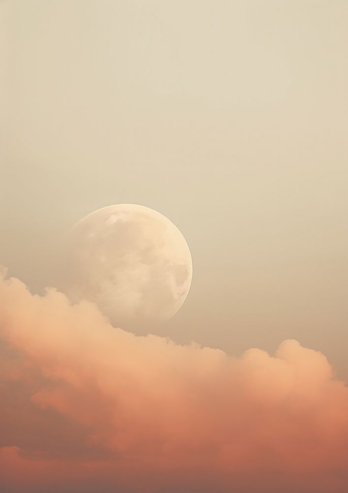 A full moon is seen through the clouds astronomy outdoors nature.