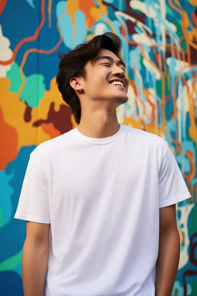 Asian American man wearing white t-shirt smile men architecture.