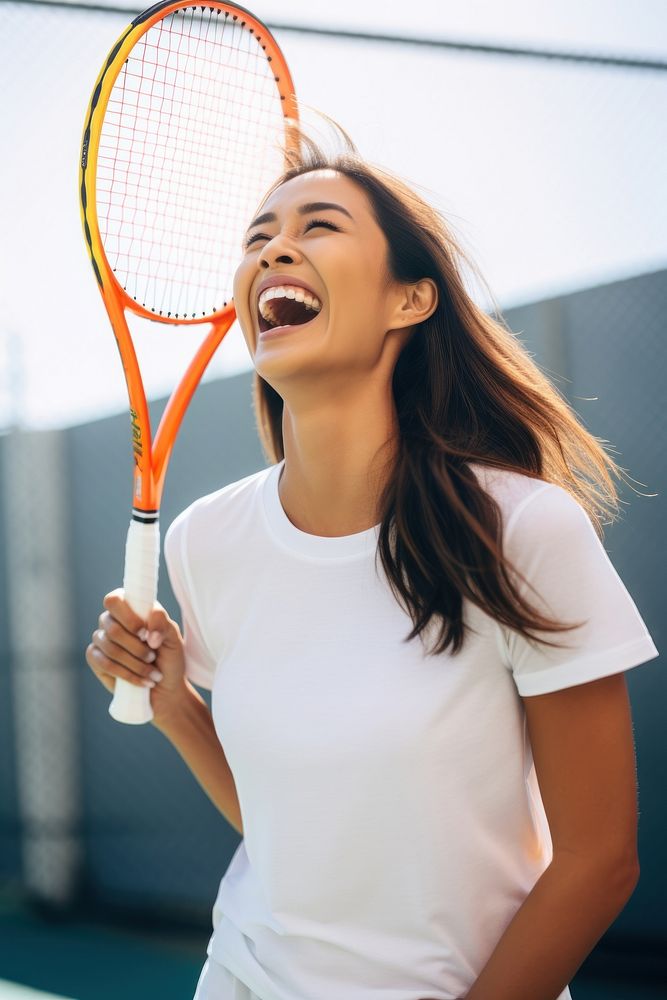 Asian American woman wearing white t-shirt tennis sports racket.