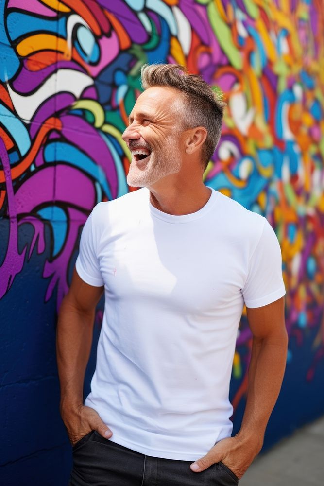 Happy american middle age man wearing white t-shirt laughing adult men.