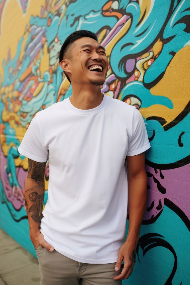 Happy asian american middle age man wearing white t-shirt laughing adult men.