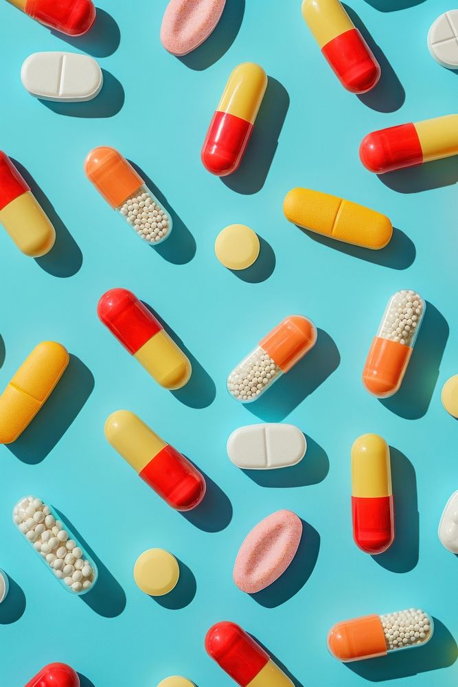 Pills and vitamin capsule blue blue background. AI generated Image by rawpixel.