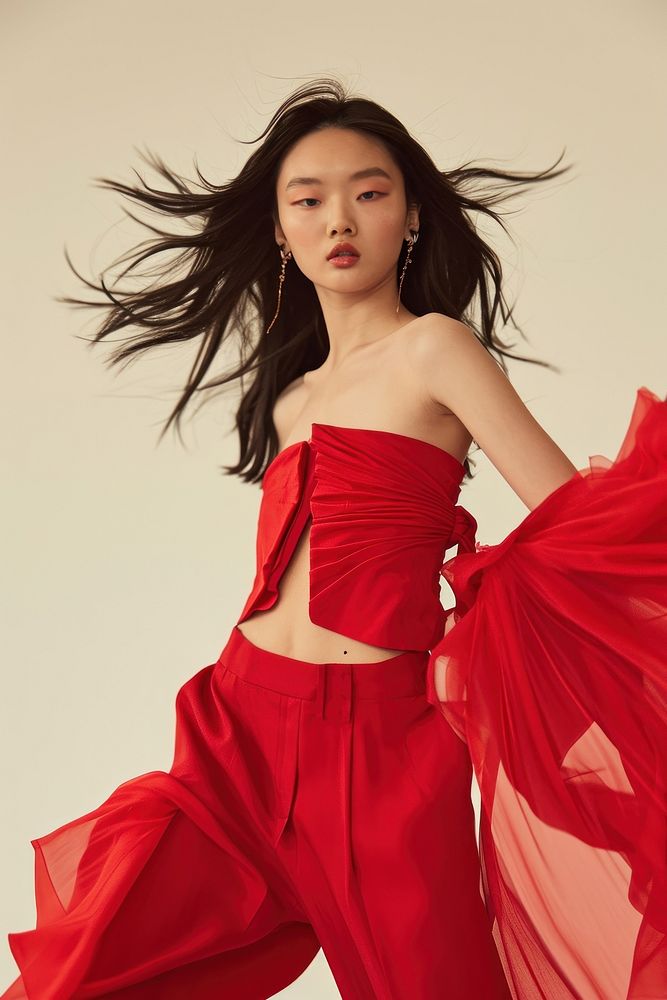Modern red strapless dress portrait standing fashion.