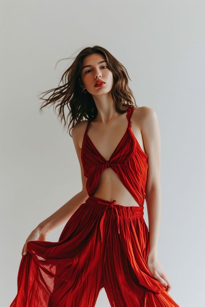 Red spaghetti strap dress fashion portrait standing.