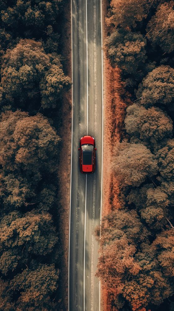 Aerial top down view of Car driving in country road car landscape outdoors.